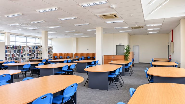 A massive library with extensive physical collections and digital databases