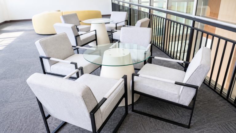 Contemporary furniture arrangements in bright common areas, demonstrating functional and aesthetic spatial planning